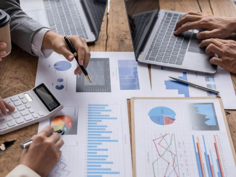 financial-analysts-analyze-business-financial-reports-on-digital-tablet-planning-investment-project.jpg